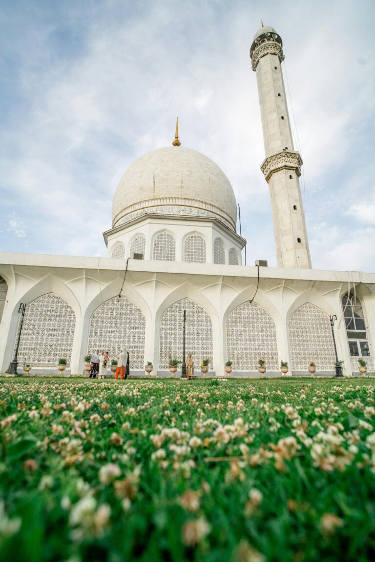 A stunning architectural shot of the Hazratbal Mosque in Srinagar, showcasing its iconic dome and minaret.